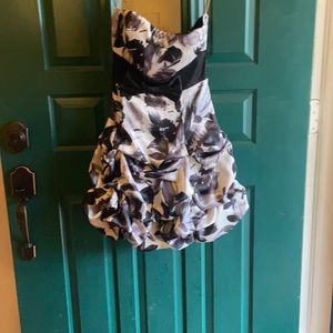 RubyRox mini satin dress with ruching skirt. Black/white floral pattern.Size 3.